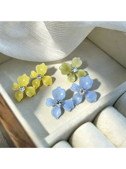 Earwish soft color floral stud earrings with pastel pink petals and gold-tone accents
