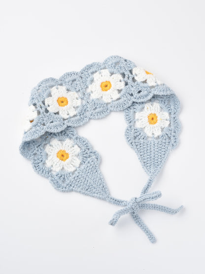 Haila crochet flower hairband laid flat highlighting its shape and flower