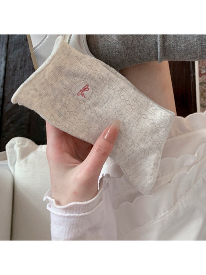 Rufia casual bow knit socks folded neatly with bow accent on top