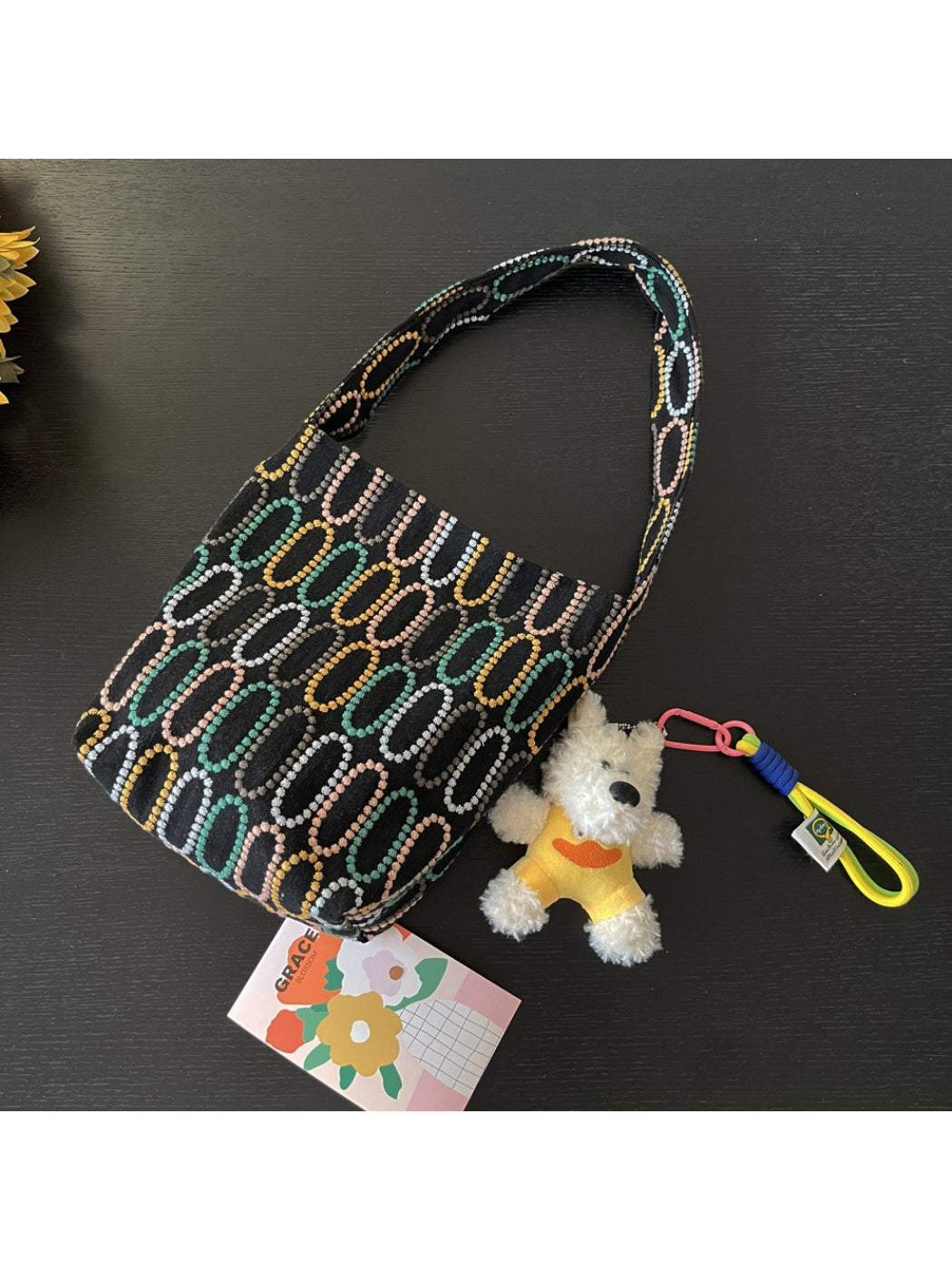 Cosbai shoulder bag worn over shoulder, showing size and fit on model