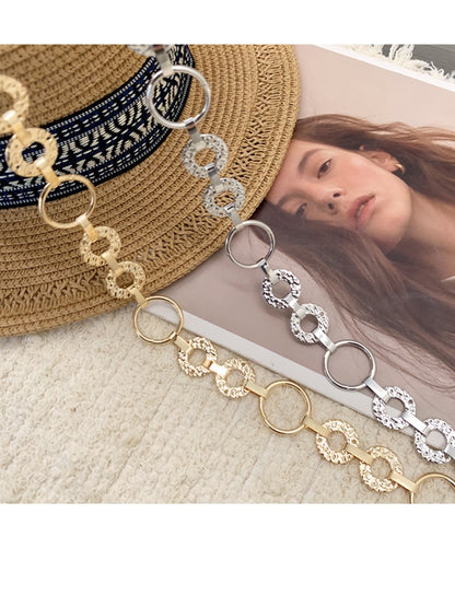 Beco pendant chain waist belt with clasp detail on a white background