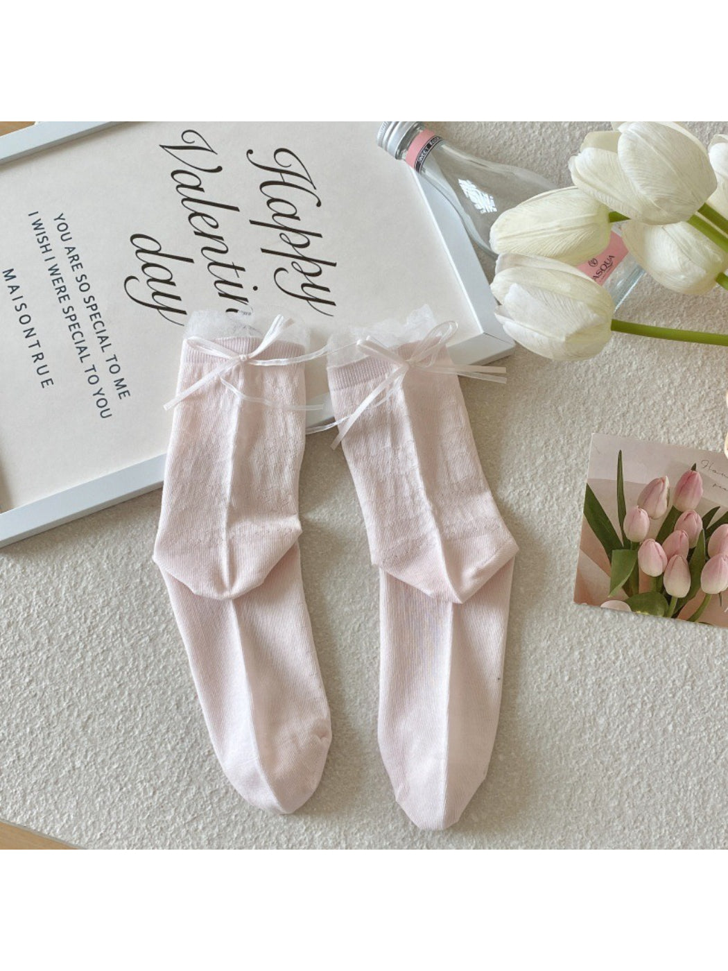 Side profile of Rufia pastel pink crew sock highlighting ribbed design
