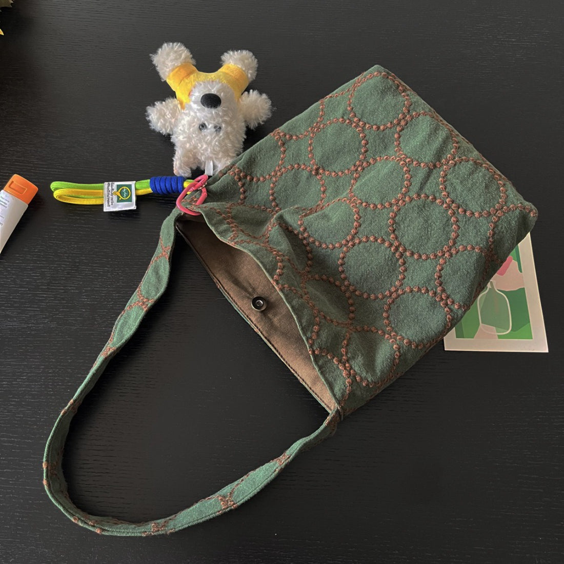 Cosbai Olive Stitch Slouchy Shoulder Bag styled with casual outfit on model