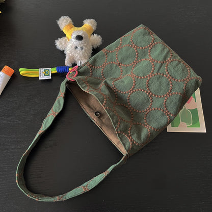 Cosbai Olive Stitch Slouchy Shoulder Bag styled with casual outfit on model