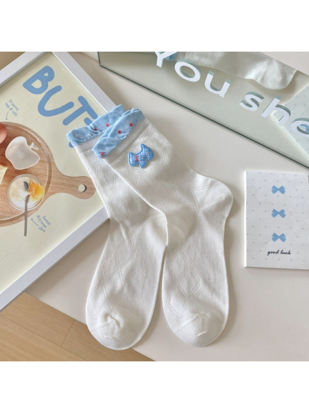 Model wearing Rufia Sweet Blue Ribbon crew socks paired with casual shoes