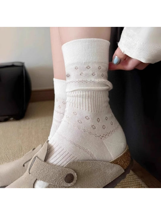 Rufia Dot Floral mid-calf socks laid flat showing floral dot pattern