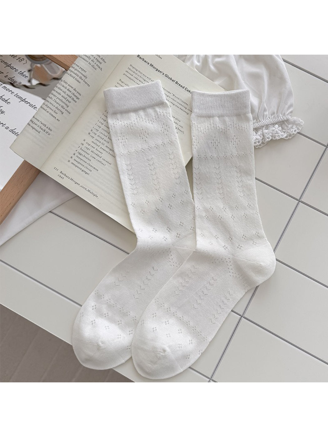 Side view of Rufia soft pointelle everyday socks in beige on white background