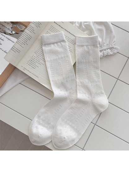 Side view of Rufia soft pointelle everyday socks in beige on white background
