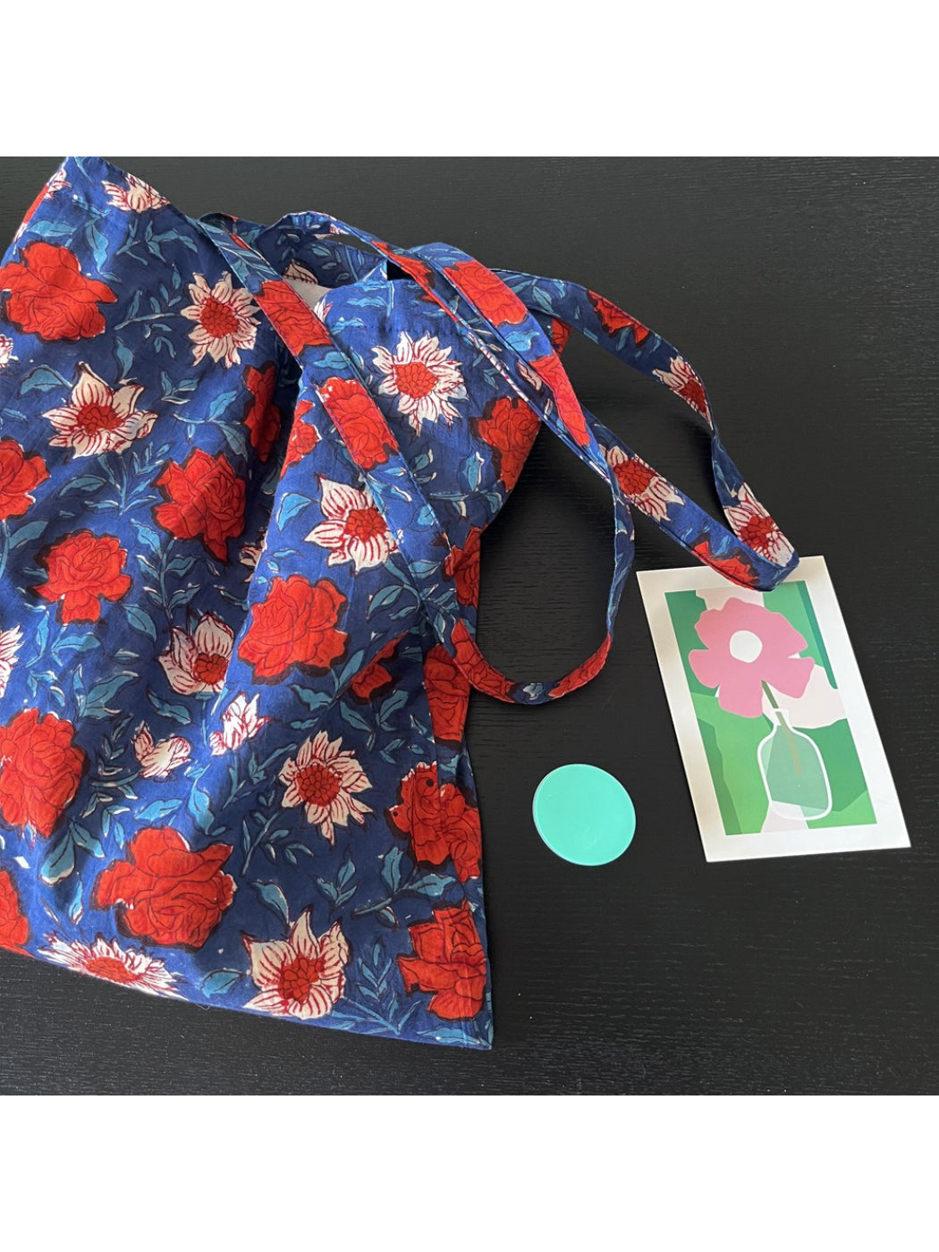 Top view of blue floral shoulder tote bag with open interior