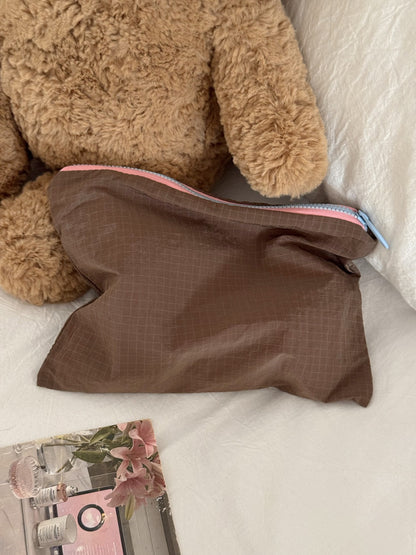 Cosbai Everyday Travel Toiletry Pouch laying flat on surface