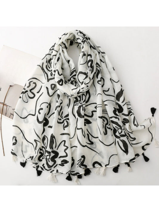 Scarvii Floral Sketch Tassel Scarf folded showing floral sketch pattern and tassel edges