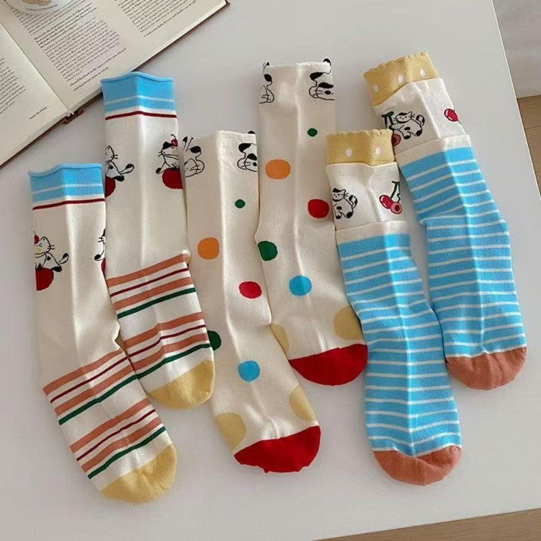 Pair of Rufia Dog Cat Stripe Crew Socks laid flat showing striped pattern