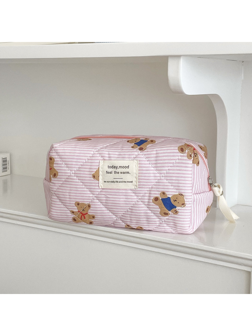 Close-up of quilted texture and on Cosbai bear cosmetic pouch