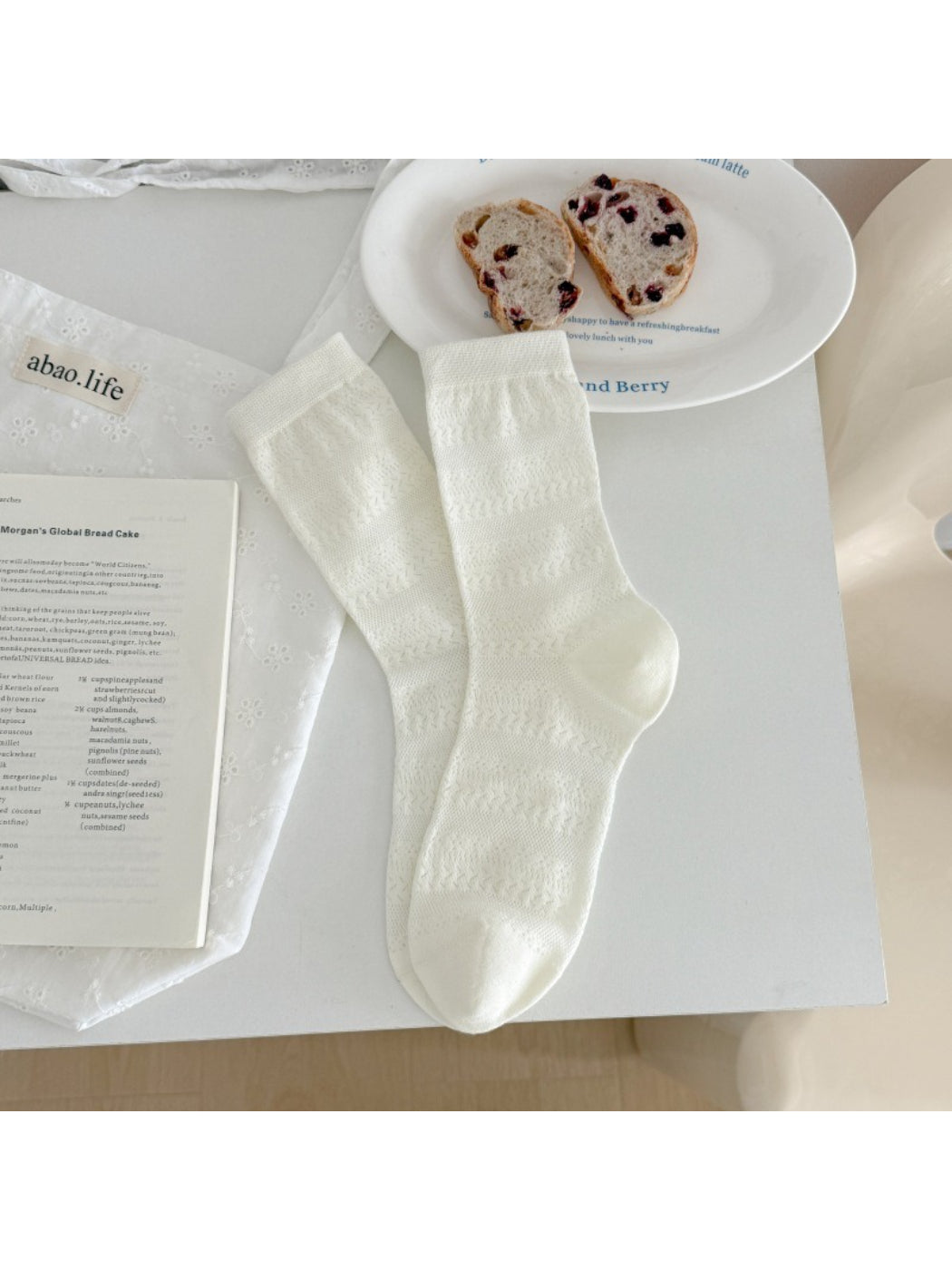 Rufia neutral textured crew socks worn on feet showing fit and length