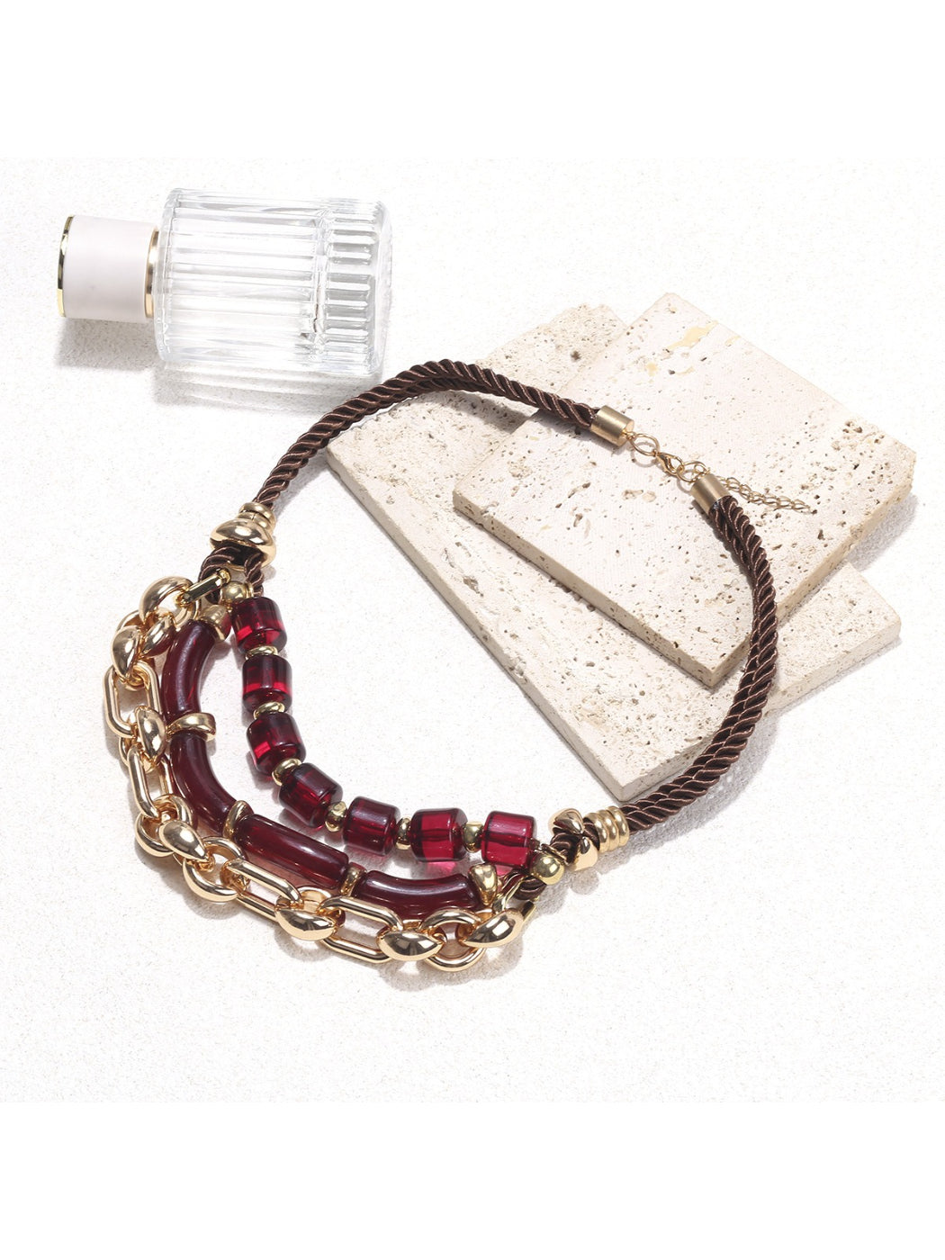 Detailed view of red beads on the layered chain necklace by Neckit