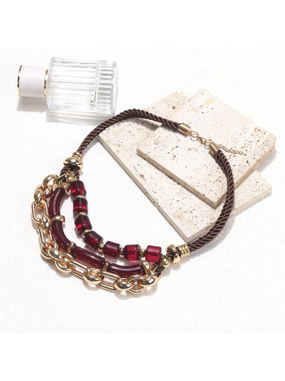 Detailed view of red beads on the layered chain necklace by Neckit