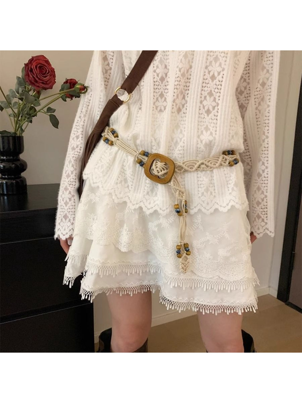 Beco braided knot square buckle belt laid flat showing full length and texture