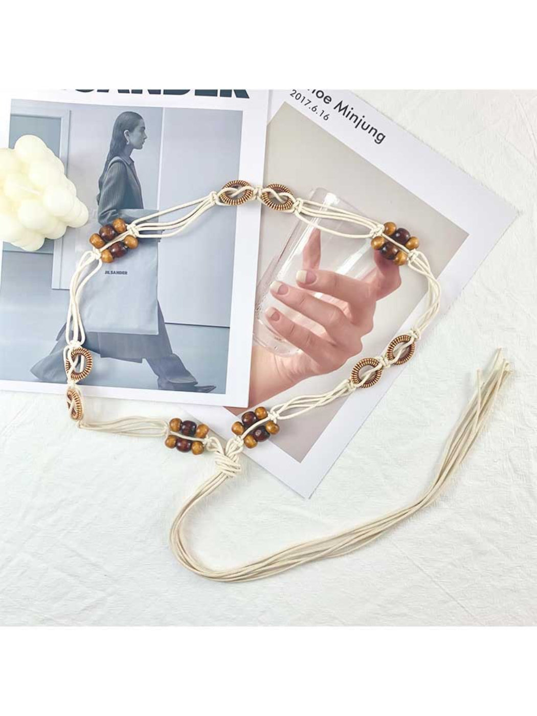 Beco floral rope tie waist belt laid flat showing full length and floral design