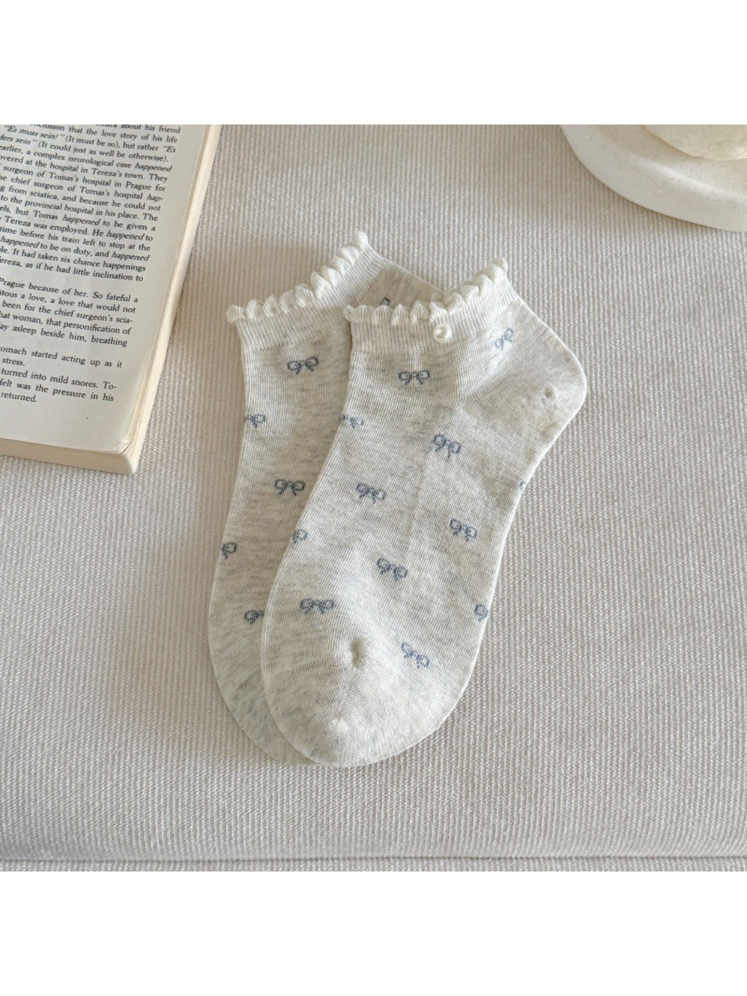 Rufia ankle socks folded to show bow print and frill detail on cuff