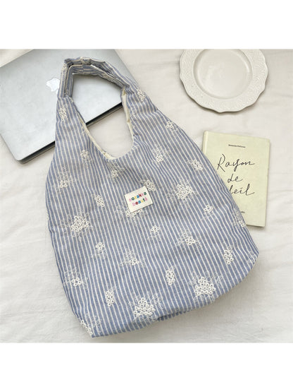 Side view of Cosbai Soft Stripe Everyday Tote Bag showing striped pattern and handles