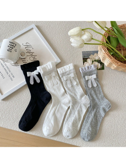 Rufia Sweet Ribbon Trim Crew Socks in white with pink ribbon detail