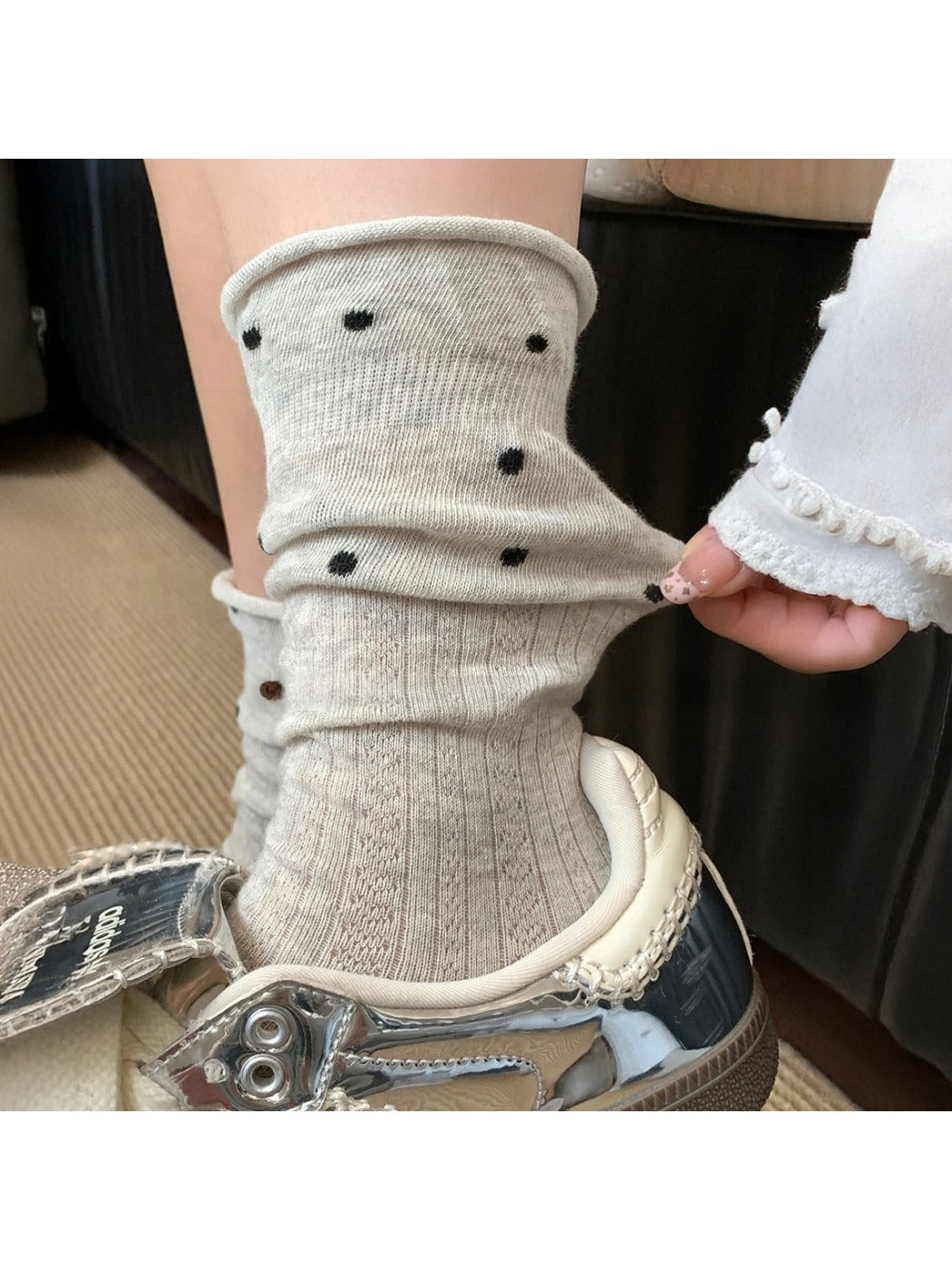 Rufia mid-calf socks with ruffle trim and mesh dot pattern shown from front angle