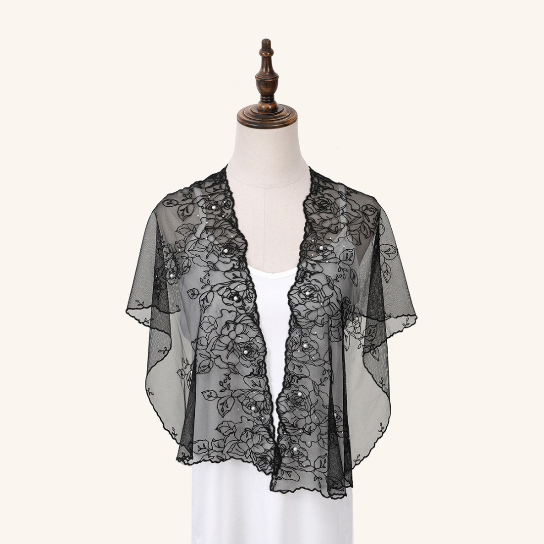Scarvii sheer floral wrap draped over shoulders with soft pastel colors visible