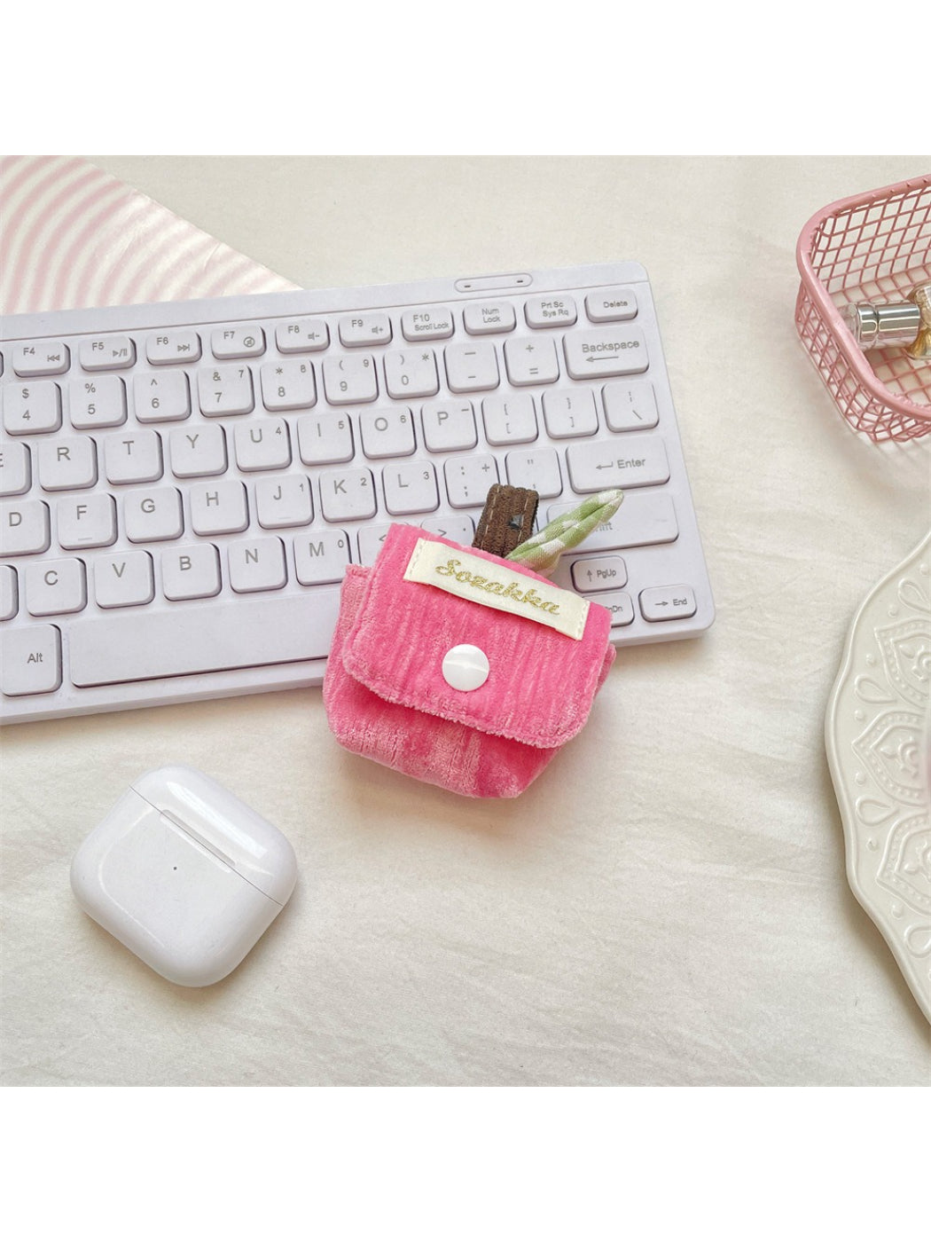 Cosbai plush mini earbuds pouch bag in light pink with a keychain attachment