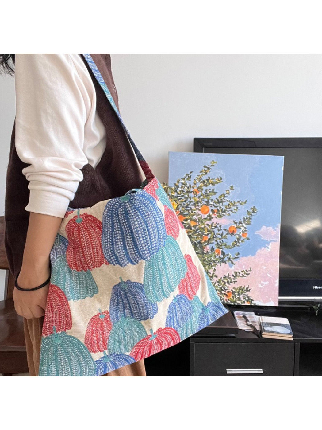 Cosbai vintage pumpkin shoulder tote displayed on a model wearing casual outfit