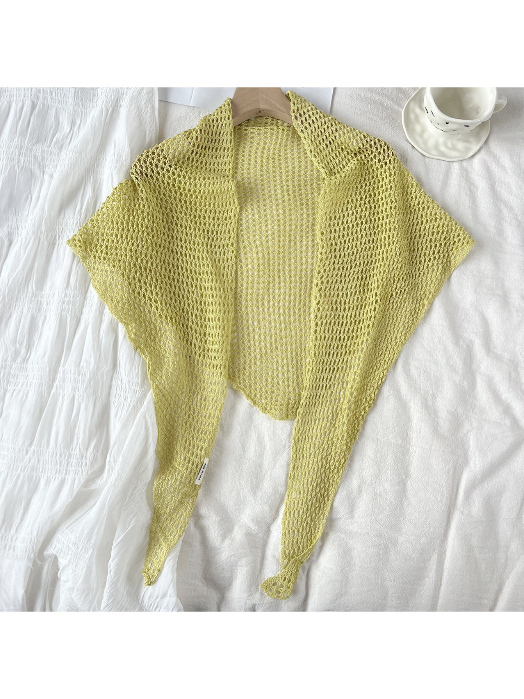 Triangle shawl scarf folded to show textured crochet pattern