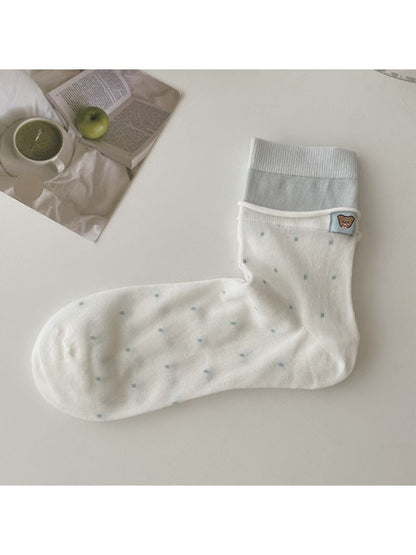 Side view of Rufia socks showing ankle length and color contrast