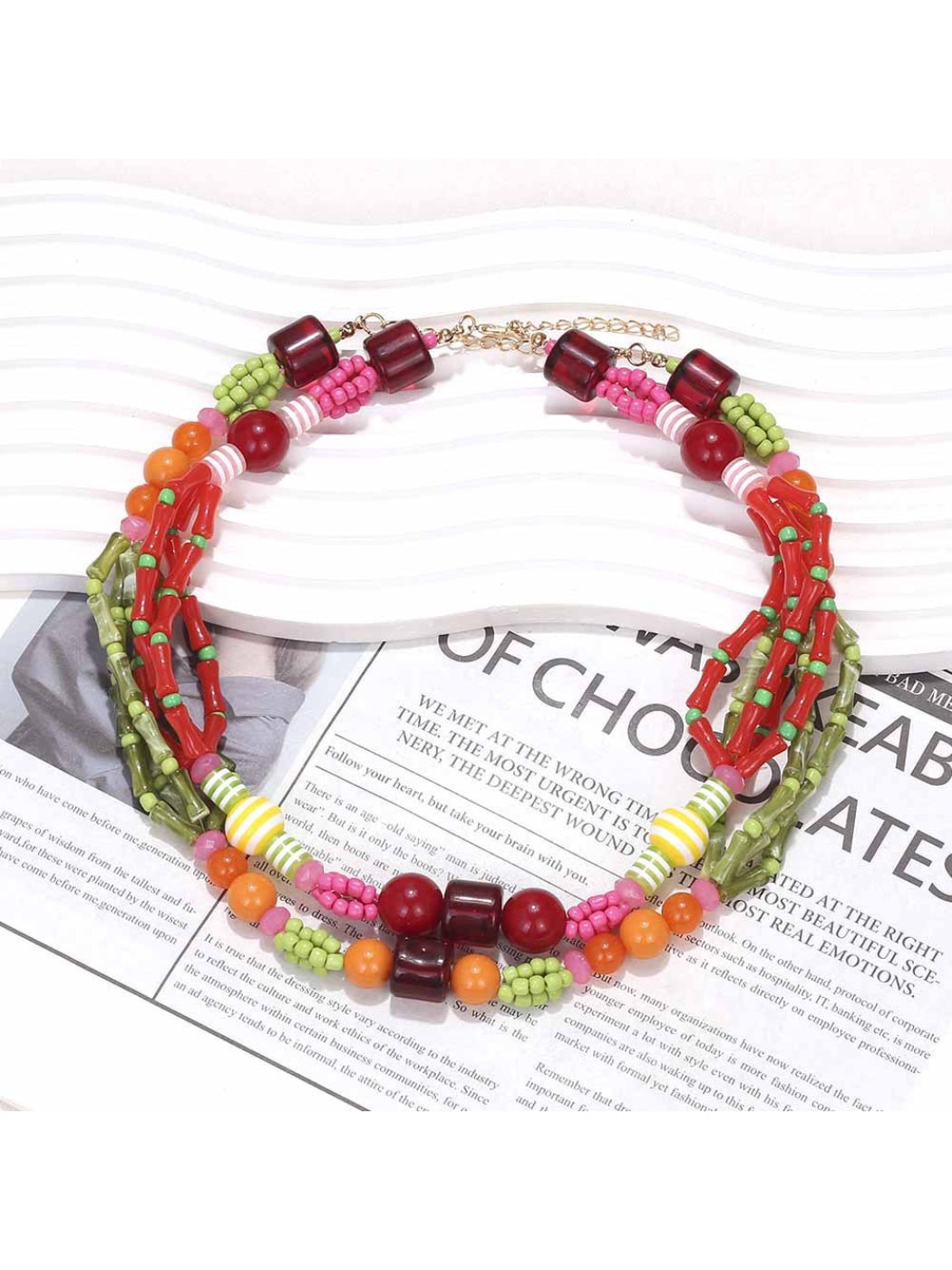 Close-up of colorful layered beaded necklace showing vibrant summer colors