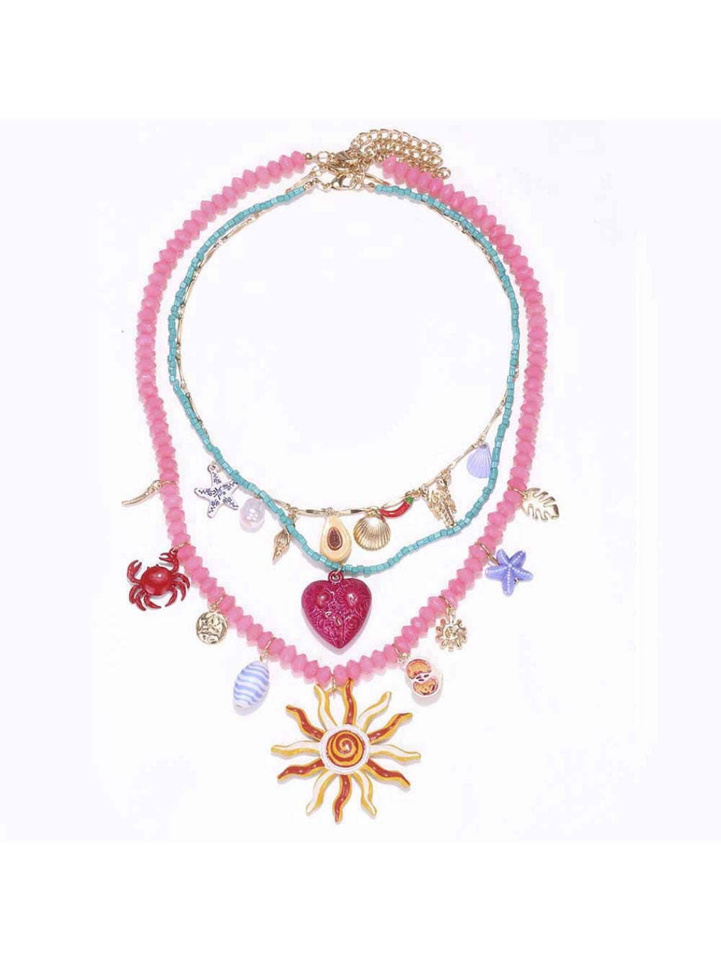 Neckit layered charm necklace featuring sun and heart detail on a white background