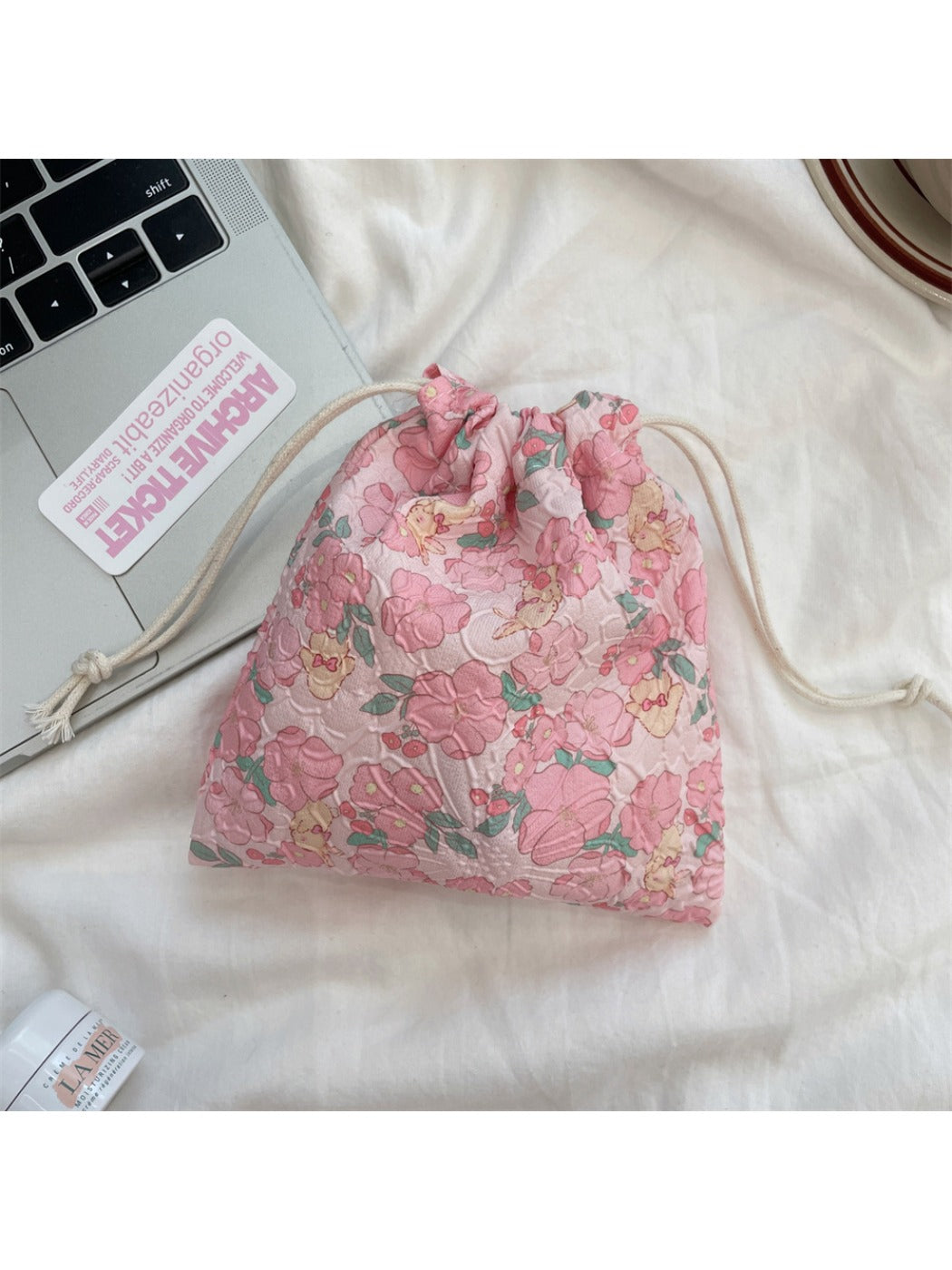 Cosbai cartoon drawstring pouch displayed on plain background showing full design