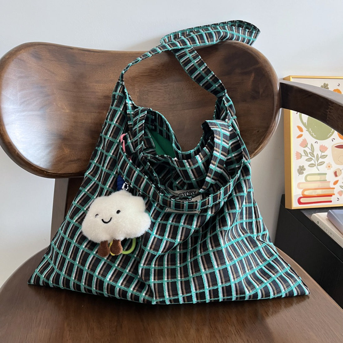 Model carrying Cosbai slouchy checked shoulder tote bag on shoulder
