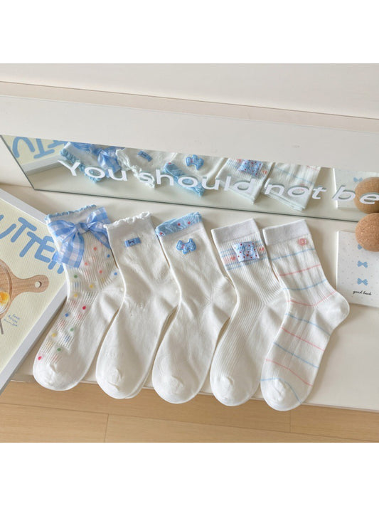 Pair of Rufia Sweet Blue Ribbon crew socks laid flat showing blue ribbon design