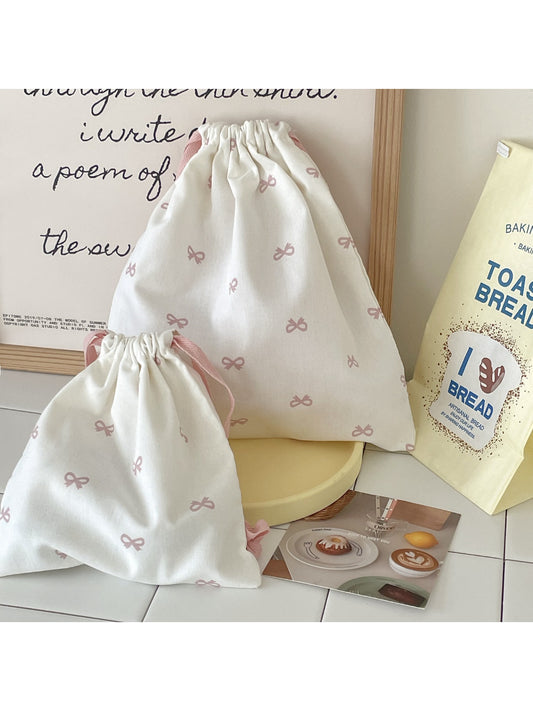 Cosbai drawstring pouch with bow pattern in soft fabric, front view