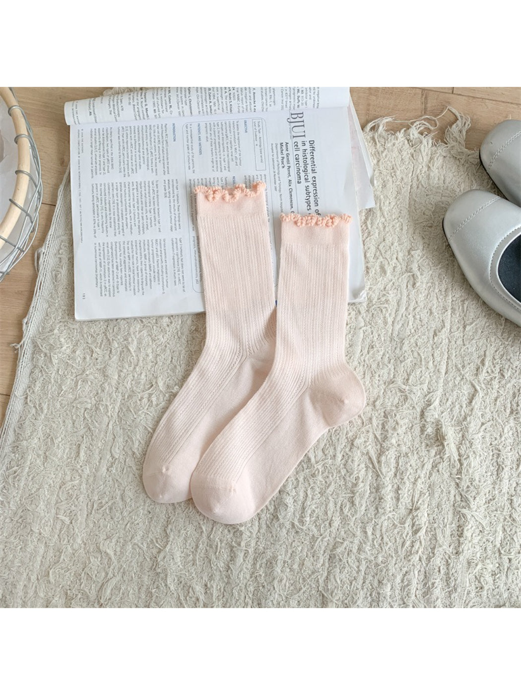 Rufia socks folded neatly to showcase frill trim and soft knit material