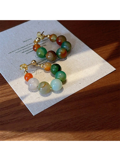 Earwish multicolor beaded hoop earrings displayed on a white background
