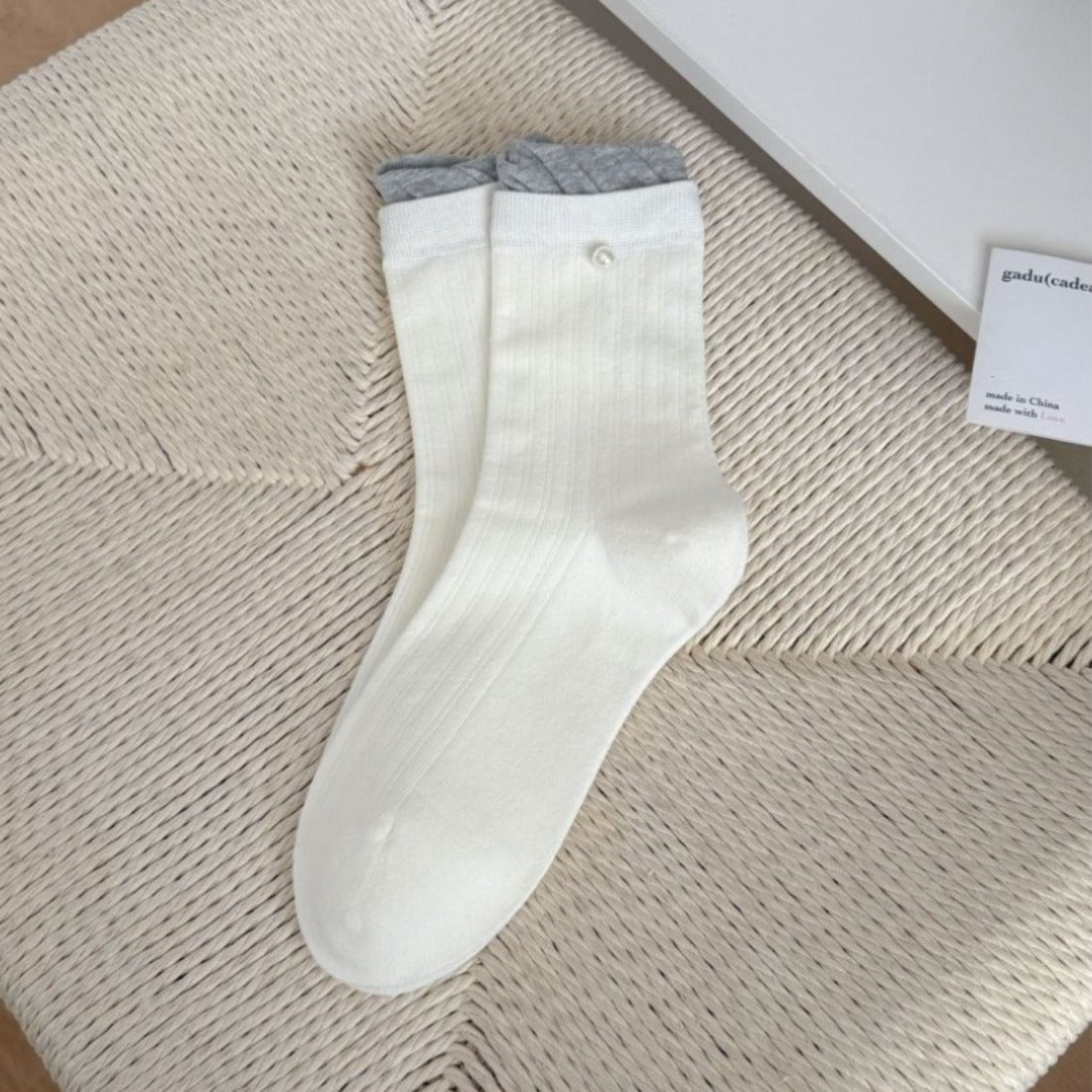 Side view of Rufia ribbed crew socks highlighting ruffle edge