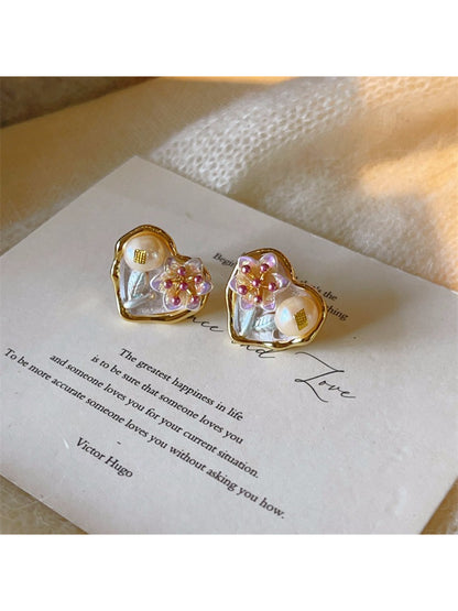 Close-up of Earwish Romantic Floral Heart Earrings with pink and red flower design