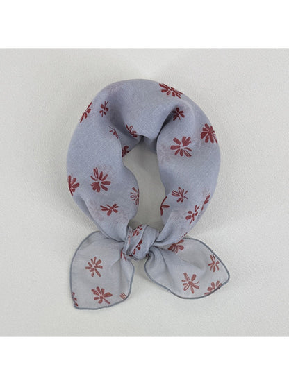 Scarvii Ditsy Daisy Square Scarf folded showing floral daisy pattern on light background