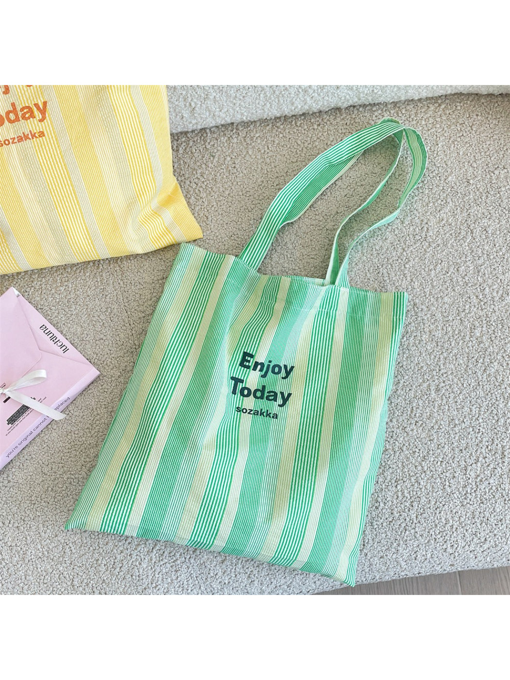 Cosbai casual stripe shopper tote bag displayed hanging on a wooden hook