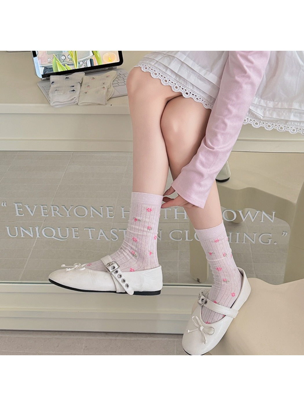 Close-up of ribbed texture and ditsy floral print on Rufia crew socks