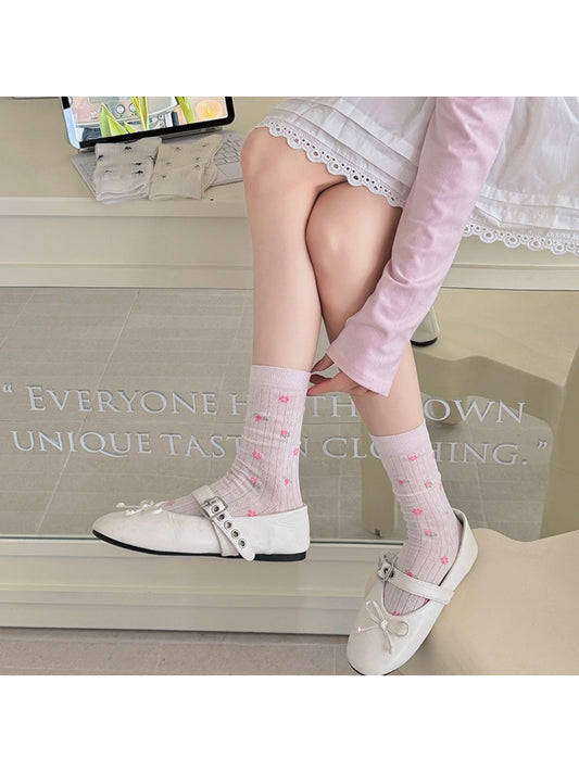 Close-up of ribbed texture and ditsy floral print on Rufia crew socks