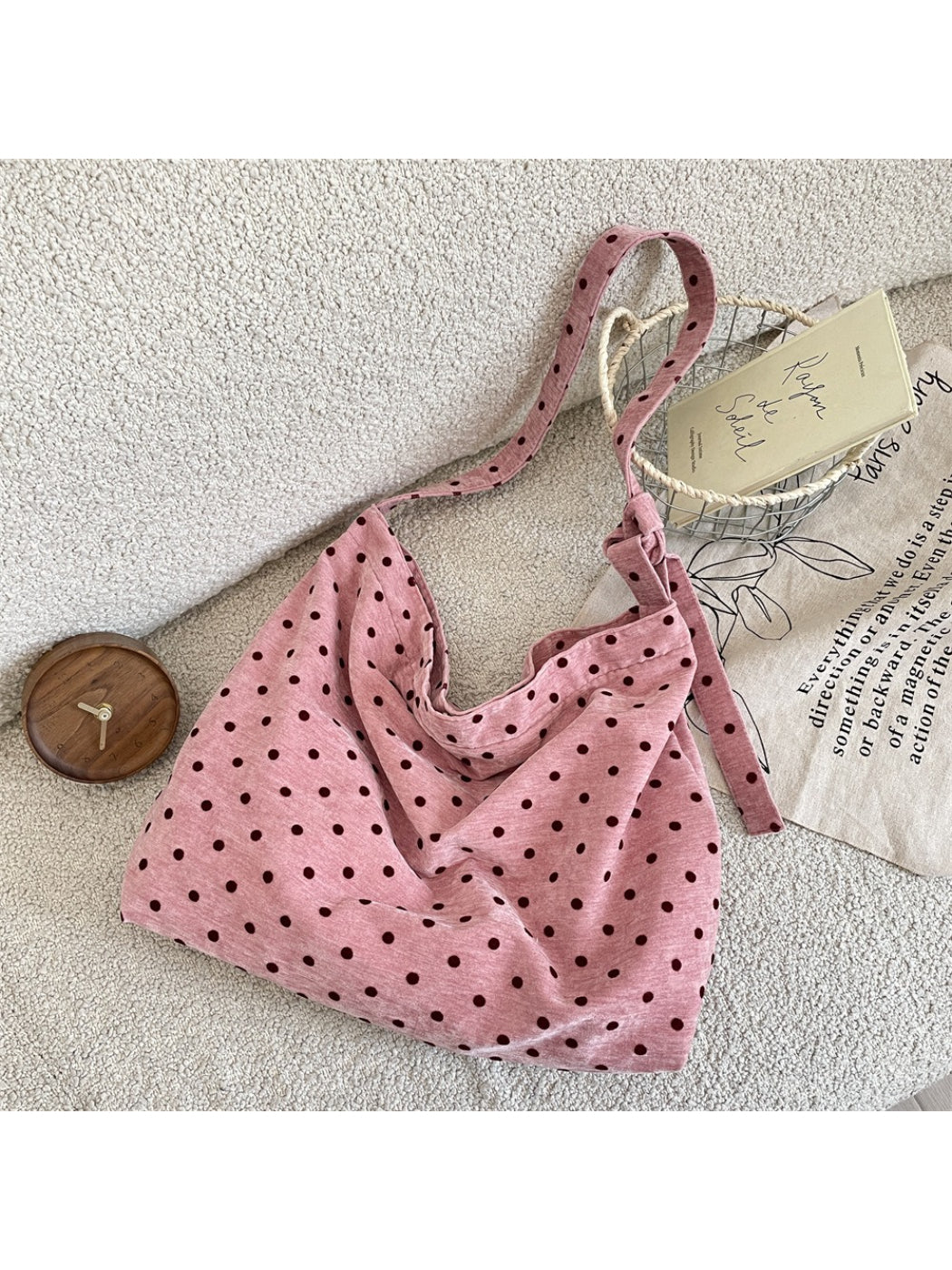 Close-up of Cosbai Polka Dot Crossbody Slouchy Bag fabric with white polka dots on black background