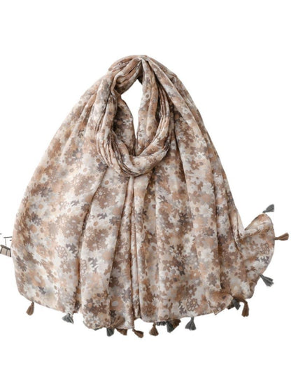 Folded bright ditsy floral wrap scarf showing vibrant flower print
