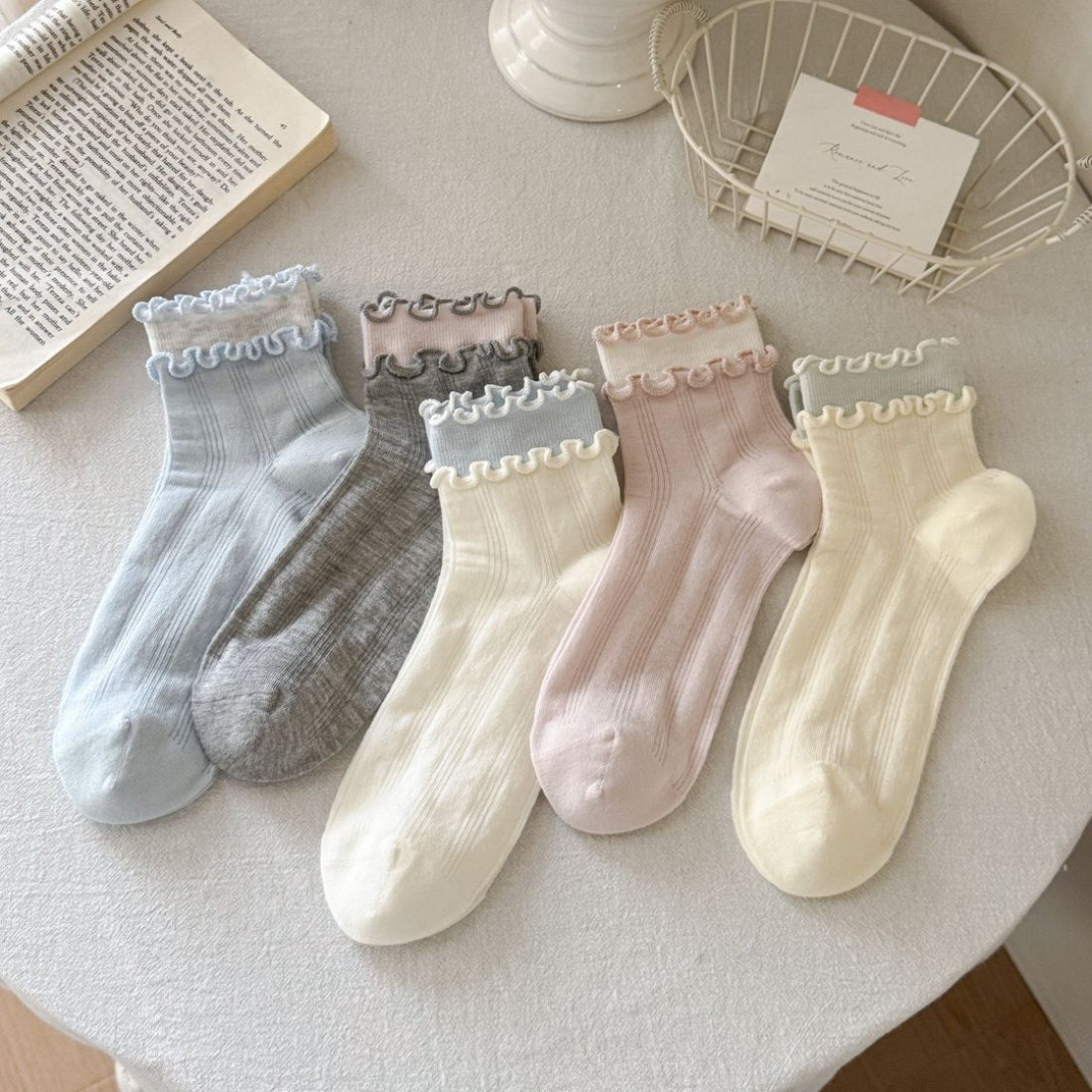 Side view of Rufia Sweet Ruffle Edge Crew Socks showing ribbed texture and ruffle trim