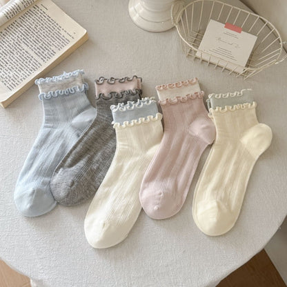 Side view of Rufia Sweet Ruffle Edge Crew Socks showing ribbed texture and ruffle trim