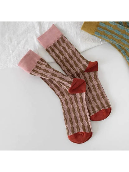 Rufia crew socks worn with casual shoes, highlighting bold knit pattern